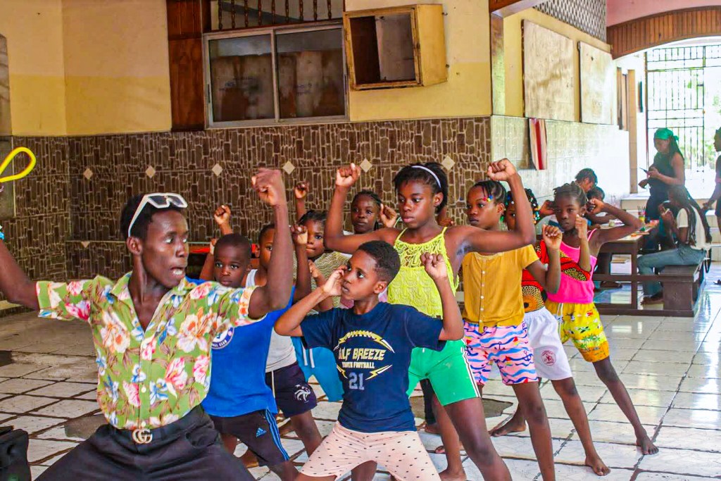 Haitian children in Port-au-Prince enjoy rare moment of recreation and learning at summer camp escape