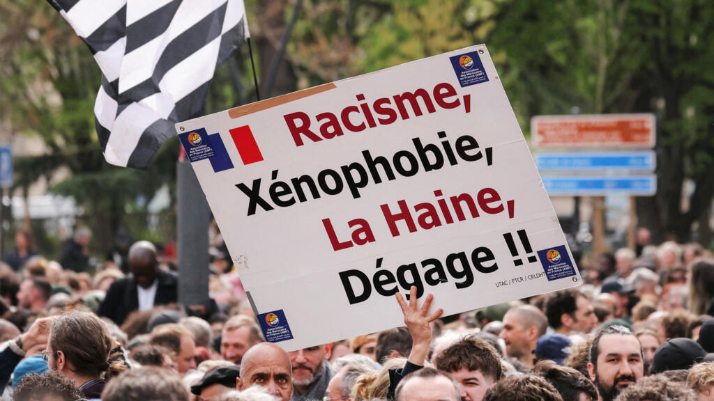 Thousands rally against racism in Paris suburb to defend mayor