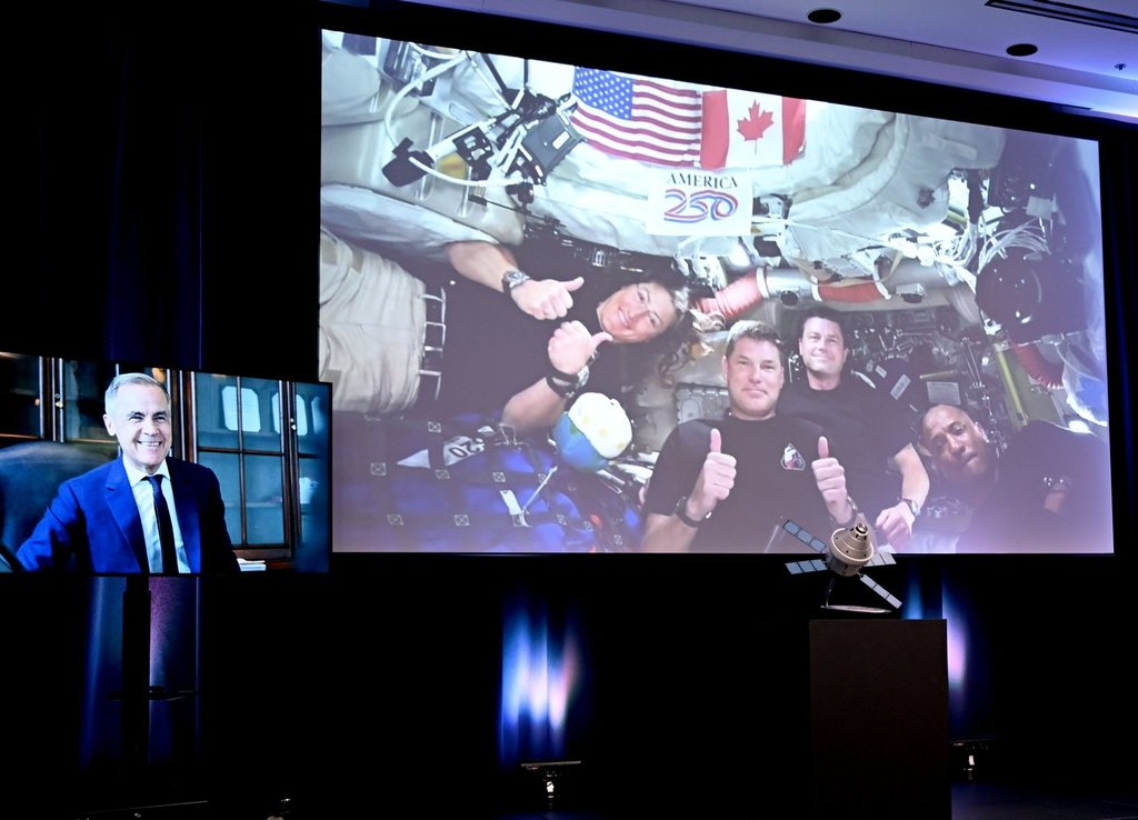 Carney praises Hansen, calls hearing French from space a point of pride