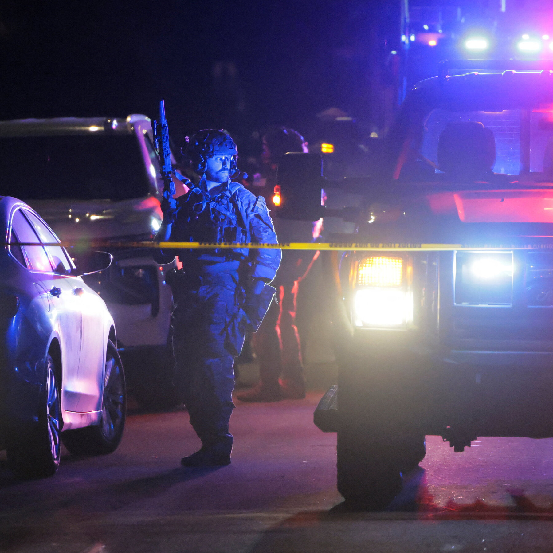 Federal authorities swarm the suspect’s home in an L.A. suburb.