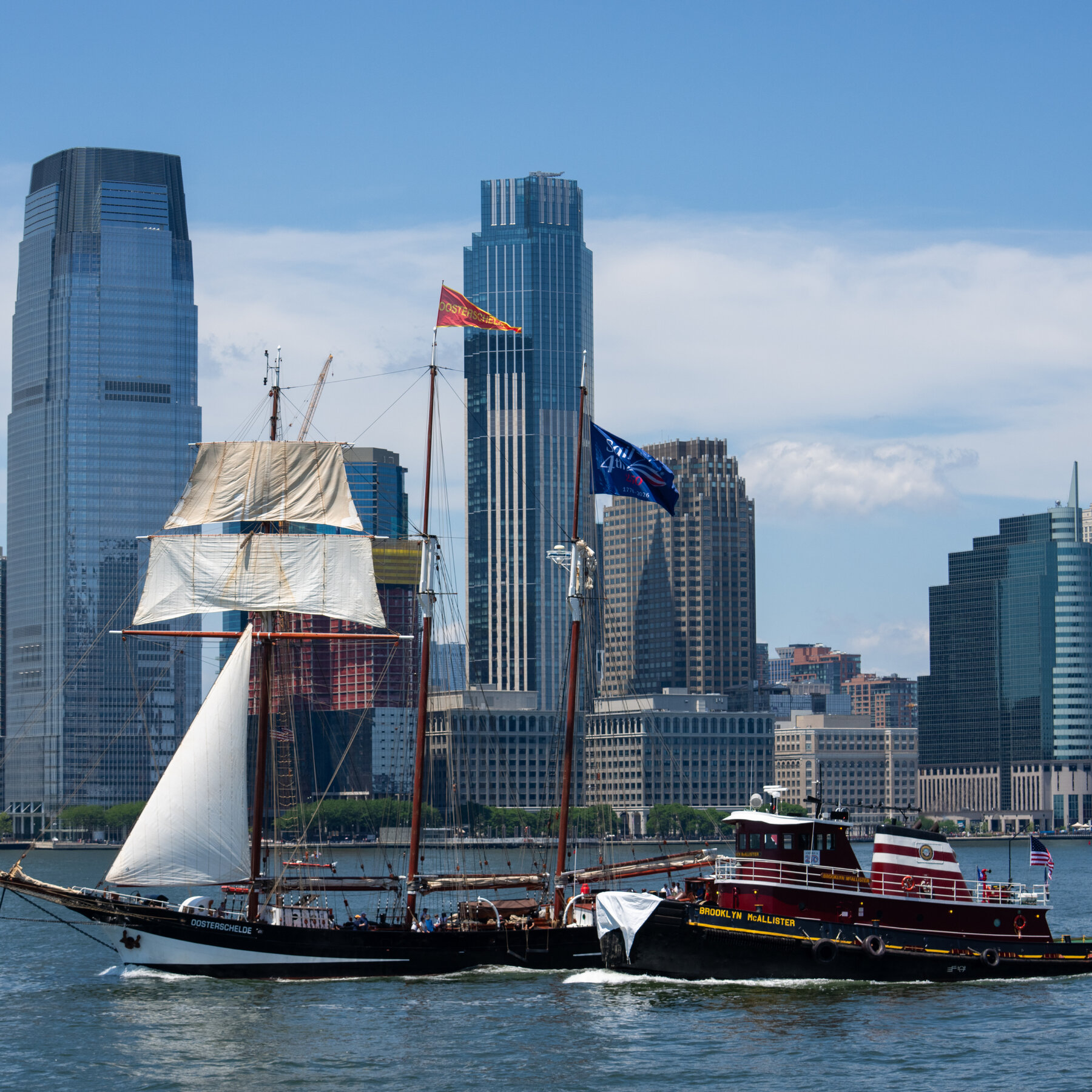 Watching the tall ships parade from a small tugboat.